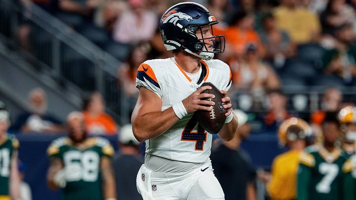 Aug 21, 2026; Denver, Colorado, USA; Denver Broncos quarterback Sam Ehlinger (4) drops back in the fourth quarter against the Green Bay Packers at Empower Field at Mile High. Aug 21, 2026; Denver, Colorado, USA; Denver Broncos quarterback Sam Ehlinger (4) drops back in the fourth quarter against the Green Bay Packers at Empower Field at Mile High.
