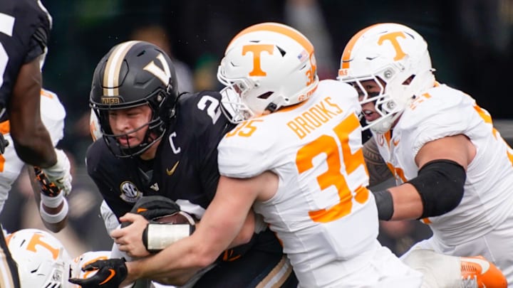 Tennessee defensive back Will Brooks (35) stops Vanderbilt quarterback Diego Pavia (2) during the second quarter at FirstBank Stadium in Nashville, Tenn., Saturday, Nov. 30, 2024.