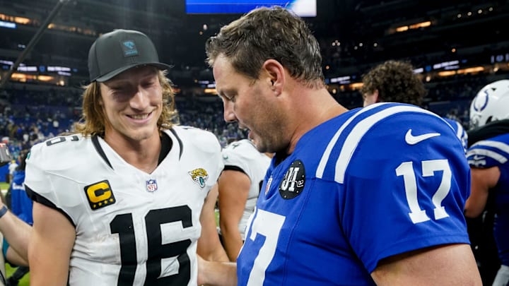 Jacksonville Jaguars quarterback Trevor Lawrence (16) and Indianapolis Colts quarterback Philip Rivers (17) meet on the field Sunday, Dec. 28, 2025, after the Jacksonville Jaguars defeated the Indianapolis Colts 23-17 at Lucas Oil Stadium in Indianapolis.