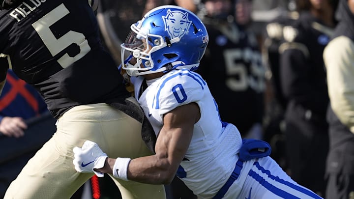 Nov 30, 2024; Winston-Salem, North Carolina, USA; Wake Forest Demon Deacons wide receiver Horatio Fields (5) makes a touchdown catch defended by Duke Blue Devils cornerback Chandler Rivers (0) at Allegacy Federal Credit Union Stadium. Mandatory Credit: Jim Dedmon-Imagn Images