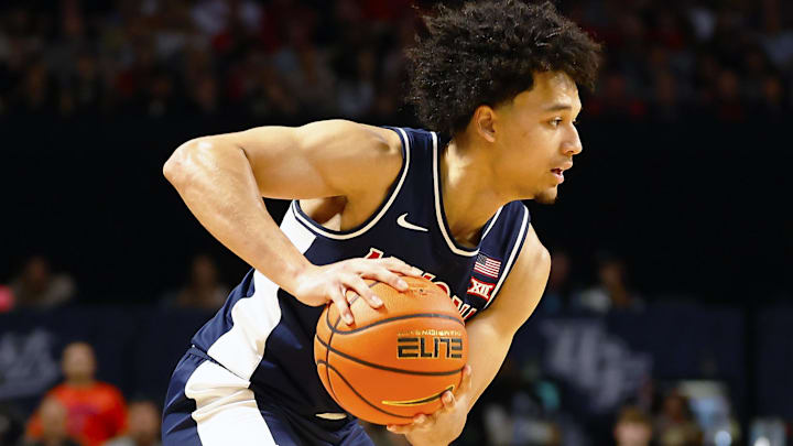 Jan 17, 2026; Orlando, Florida, USA;  Central Florida Knights guard Riley Kugel (2) defends Arizona Wildcats guard Brayden Burries (5) in the second half at Addition Financial Arena. Mandatory Credit: Russell Lansford-Imagn Images