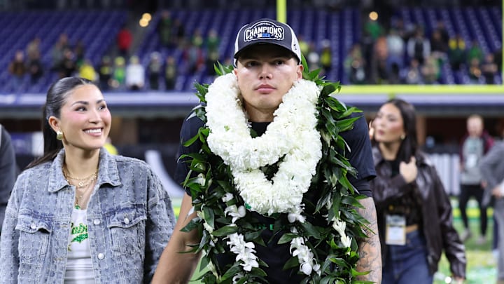 Dec 7, 2024; Indianapolis, IN, USA; Oregon Ducks quarterback Dillon Gabriel (8) walks around the field after defeating the Penn State Nittany Lions to win the Big Ten Championship in the 2024 Big Ten Championship game at Lucas Oil Stadium. Mandatory Credit: Jordan Prather-Imagn Images