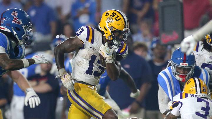 LSU Tigers running back Dilin Jones (13) carries the ball against the Mississippi Rebels during the third quarter at Vaught-Hemingway Stadium. LSU Tigers running back Dilin Jones (13) carries the ball against the Mississippi Rebels during the third quarter at Vaught-Hemingway Stadium.