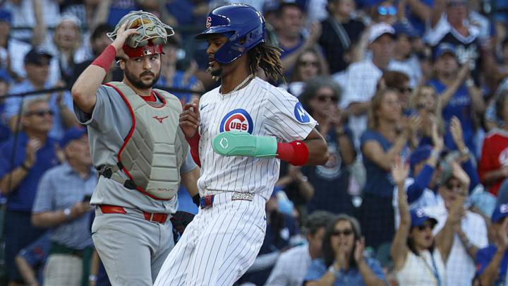 Sep 28, 2025; Chicago, Illinois, USA; Chicago Cubs outfielder Kevin Alcantara (13) scores against the St. Louis Cardinals during the seventh inning at Wrigley Field. Mandatory Credit: Kamil Krzaczynski-Imagn Images