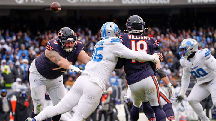 Chicago Bears quarterback Caleb Williams (18) escapes Detroit Lions defensive end Pat O'Connor (95) Chicago Bears quarterback Caleb Williams (18) escapes Detroit Lions defensive end Pat O'Connor (95)