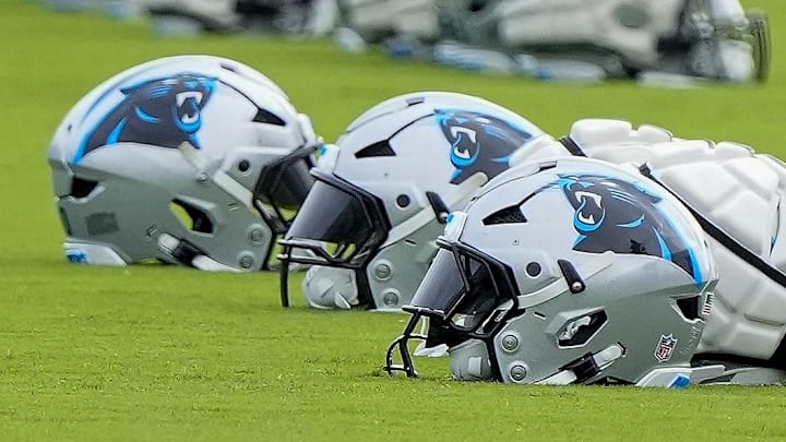 Jul 30, 2024; Charlotte, NC, USA; Carolina Panthers helmets at Carolina Panthers Practice Fields. Mandatory Credit: Jim Dedmon-Imagn Images