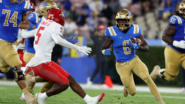 Sep 12, 2025; Pasadena, California, USA; UCLA Bruins running back Anthony Woods (6) runs with the ball during the second quarter against the New Mexico Lobos at Rose Bowl. Mandatory Credit: Kiyoshi Mio-Imagn Images Sep 12, 2025; Pasadena, California, USA; UCLA Bruins running back Anthony Woods (6) runs with the ball during the second quarter against the New Mexico Lobos at Rose Bowl. Mandatory Credit: Kiyoshi Mio-Imagn Images