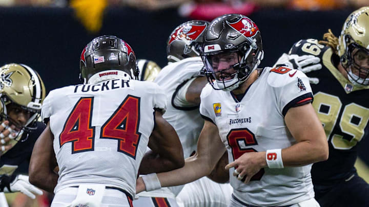 Oct 13, 2024; New Orleans, Louisiana, USA;  Tampa Bay Buccaneers quarterback Baker Mayfield (6) hands off to running back Sean Tucker (44) during the second half against the New Orleans Saints at Caesars Superdome. Mandatory Credit: Stephen Lew-Imagn Images