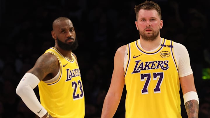 Los Angeles Lakers forward LeBron James (23) and guard Luka Doncic (77) during the second quarter against the Charlotte Hornets at Crypto.com Arena.