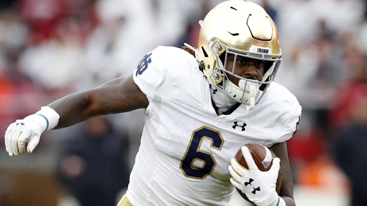 Nov 30, 2019; Stanford, CA, USA; Notre Dame Fighting Irish running back Tony Jones Jr. (6) carries the ball during the first quarter against the Stanford Cardinal at Stanford Stadium. 