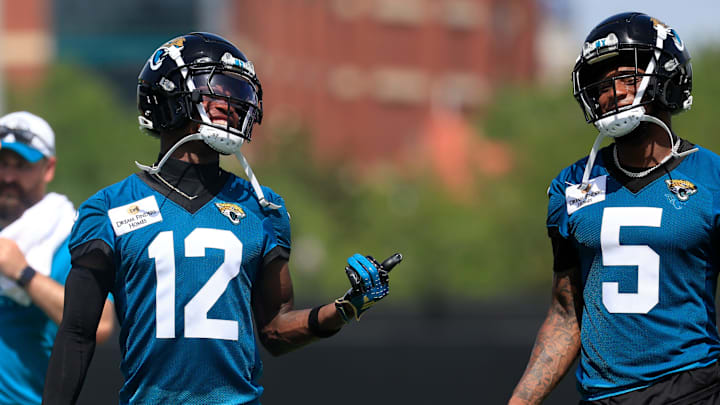 Jacksonville Jaguars wide receiver Travis Hunter (12) smiles with wide receiver Dyami Brown (5) during the 10th organized team activity at Miller Electric Center Wednesday, June 4, 2025 in Jacksonville, Fla. [Corey Perrine/Florida Times-Union]
