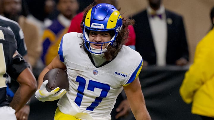 Dec 1, 2024; New Orleans, Louisiana, USA; Los Angeles Rams wide receiver Puka Nacua (17) scores a touchdown against New Orleans Saints linebacker Pete Werner (20) during the second half at Caesars Superdome. Mandatory Credit: Matthew Hinton-Imagn Images