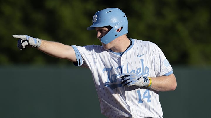 North Carolina Tar Heels Parks Harber (14) reacts to hitting a double against the West Virginia Mountaineers in the third inning of the DI Baseball Super Regional at Boshamer Stadium. 