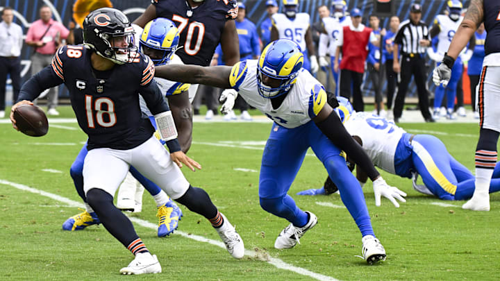 Sep 29, 2024; Chicago, Illinois, USA;  Los Angeles Rams linebacker Jared Verse (8) chases Chicago Bears quarterback Caleb Williams (18) during the first half at Soldier Field. Mandatory Credit: Matt Marton-Imagn Images