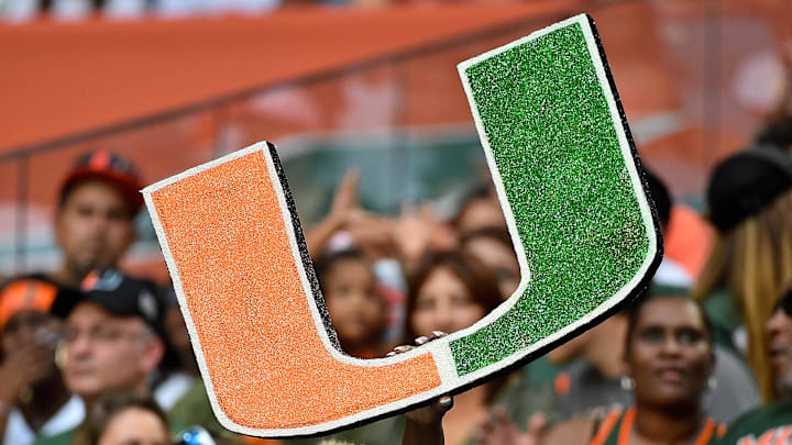 Sep 8, 2018; Miami Gardens, FL, USA; A Miami Hurricanes fan holds a school logo sign during the first half against the Savannah State Tigers at Hard Rock Stadium. Mandatory Credit: Jasen Vinlove-Imagn Images Sep 8, 2018; Miami Gardens, FL, USA; A Miami Hurricanes fan holds a school logo sign during the first half against the Savannah State Tigers at Hard Rock Stadium. Mandatory Credit: Jasen Vinlove-Imagn Images