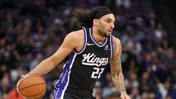 Feb 4, 2026; Sacramento, California, USA; Sacramento Kings guard Devin Carter (22) dribbles against the Memphis Grizzlies during the third quarter at Golden 1 Center.