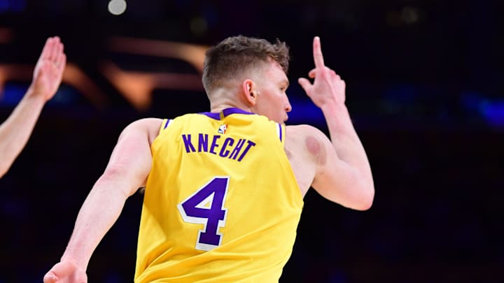 Mar 6, 2025; Los Angeles, California, USA; Los Angeles Lakers guard Dalton Knecht (4) reacts after scoring a three point basket against the New York Knicks during the second half at Crypto.com Arena. Mandatory Credit: Gary A. Vasquez-Imagn Images