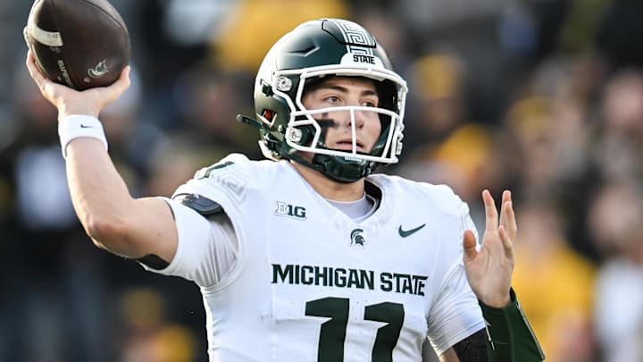 Nov 22, 2025; Iowa City, Iowa, USA; Michigan State Spartans quarterback Alessio Milivojevic (11) throws a pass against the Iowa Hawkeyes during the first quarter at Kinnick Stadium. Mandatory Credit: Jeffrey Becker-Imagn Images
