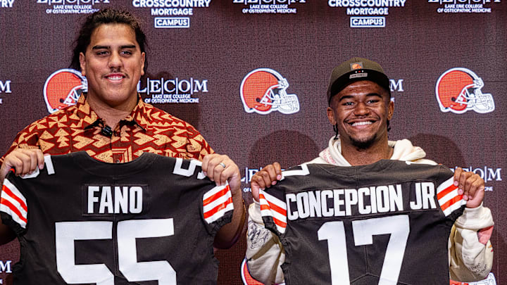 Apr 24, 2026; Berea, OH, USA; Cleveland Browns first round draft picks Spencer Fano, left, and KC Concepcion hold their new jerseys during an introductory press conference at CrossCountry Mortgage Campus. Mandatory Credit: Ken Blaze-Imagn Images