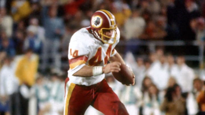 Jan 30, 1983; Pasadena, CA; USA; FILE PHOTO; Washington Redskins running back John Riggins (44) breaks loose for a 43 yard touchdown during Super Bowl XVII against the Miami Dolphins at the Rose Bowl. Riggins ran for a Super Bowl record 166 yards on 38 carries and was named most valuable player. The Redskins defeated the Dolphins 27-17. Mandatory Credit: Tony Tomsic-USA TODAY Sports Jan 30, 1983; Pasadena, CA; USA; FILE PHOTO; Washington Redskins running back John Riggins (44) breaks loose for a 43 yard touchdown during Super Bowl XVII against the Miami Dolphins at the Rose Bowl. Riggins ran for a Super Bowl record 166 yards on 38 carries and was named most valuable player. The Redskins defeated the Dolphins 27-17. Mandatory Credit: Tony Tomsic-USA TODAY Sports