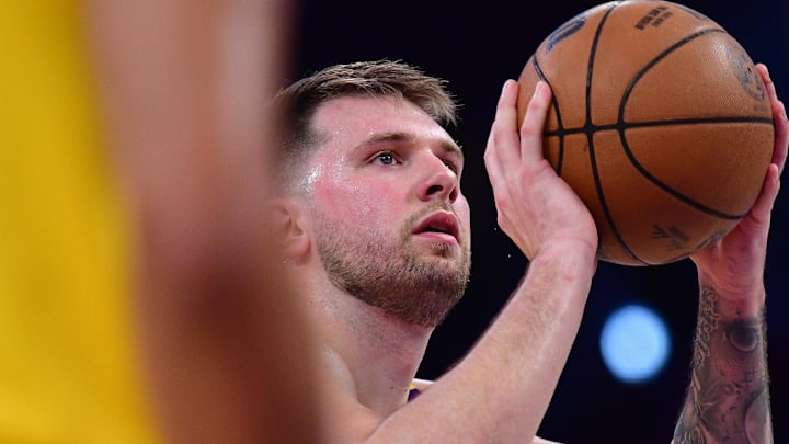Apr 30, 2025; Los Angeles, California, USA; Los Angeles Lakers guard Luka Doncic (77) shoots a free throw against the Minnesota Timberwolves during the first half in game five of first round for the 2025 NBA Playoffs at Crypto.com Arena. Mandatory Credit: Gary A. Vasquez-Imagn Images