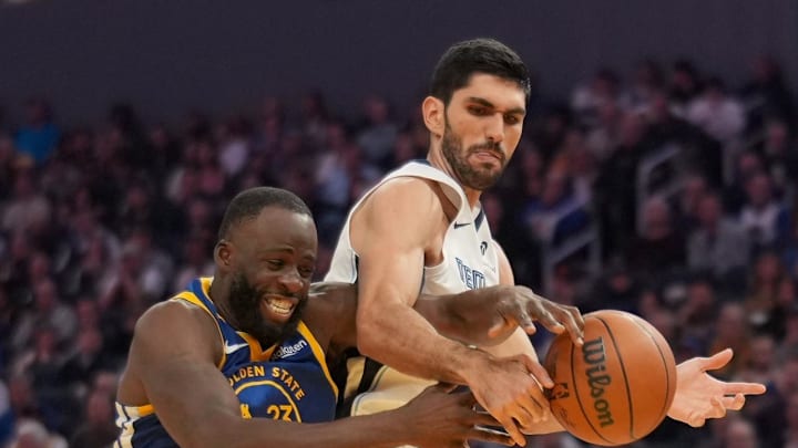 Golden State Warriors forward Draymond Green and Memphis Grizzlies forward Santi Aldama.