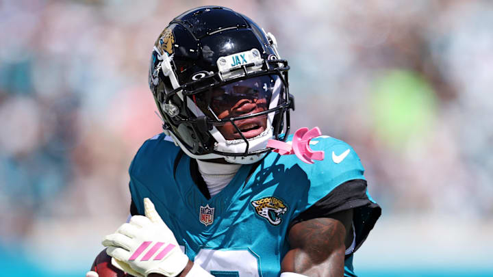 Oct 12, 2025; Jacksonville, Florida, USA; Jacksonville Jaguars wide receiver Travis Hunter (12) runs the ball during the first half against the Seattle Seahawks at EverBank Stadium. Mandatory Credit: Morgan Tencza-Imagn Images