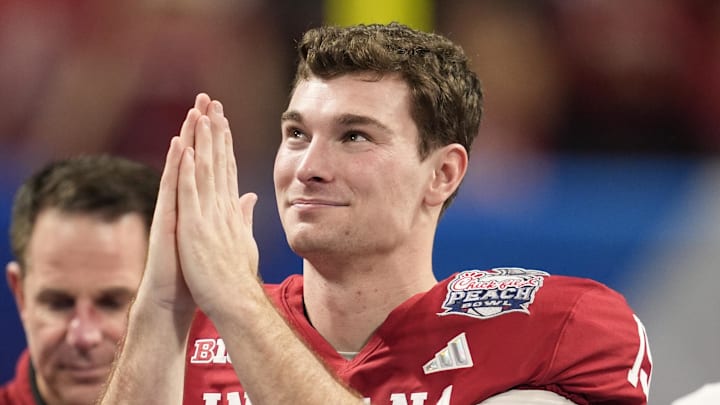 Jan 9, 2026; Atlanta, GA, USA; Indiana Hoosiers quarterback Fernando Mendoza (15) reacts after the 2025 Peach Bowl and semifinal game of the College Football Playoff at Mercedes-Benz Stadium. Mandatory Credit: Dale Zanine-Imagn Images