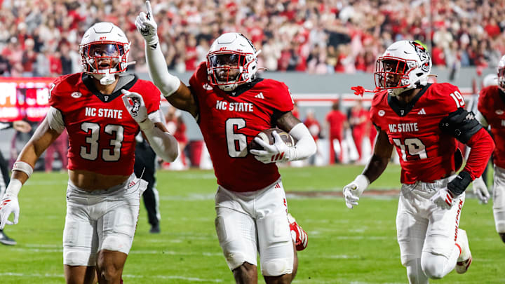 Nov 21, 2025; Raleigh, North Carolina, USA; NC State Wolfpack defensive back Devon Marshall (6) celebrates a down and runs towards the JROTC  to celebrate during the first half of the game against Florida State Seminoles at Carter-Finley Stadium. Mandatory Credit: Jaylynn Nash-Imagn Images