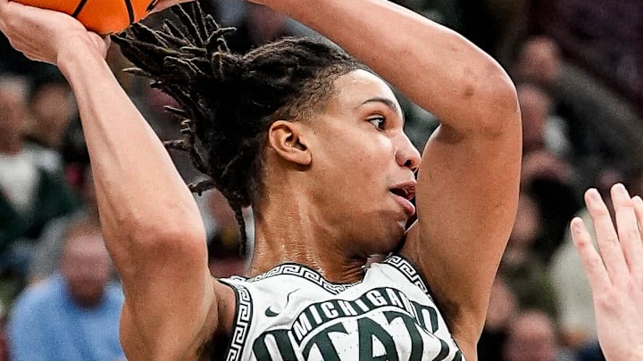 Michigan State forward Jordan Scott (6) passes the ball against UCLA forward Tyler Bilodeau (34) during the first half of Big Ten tournament quarterfinal at United Center in Chicago on Friday, March 13, 2026.