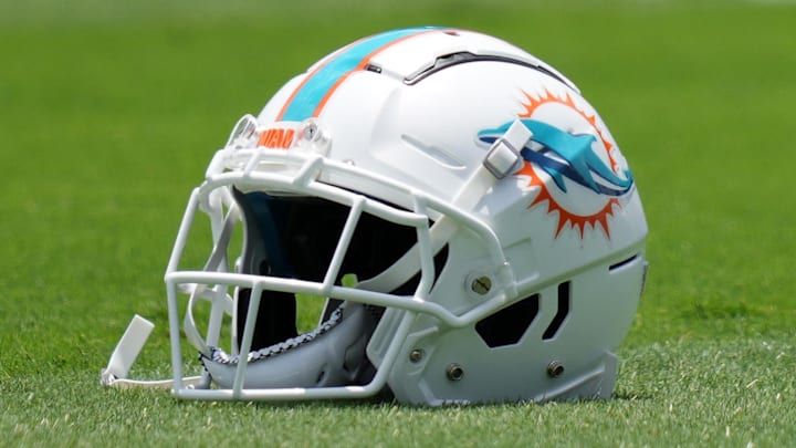 May 17, 2022; Miami Gardens, FL, USA; A general view of a Miami Dolphins helmet on the grass during OTA practice at Baptist Health Training Complex. Mandatory Credit: Jasen Vinlove-Imagn Images May 17, 2022; Miami Gardens, FL, USA; A general view of a Miami Dolphins helmet on the grass during OTA practice at Baptist Health Training Complex. Mandatory Credit: Jasen Vinlove-Imagn Images