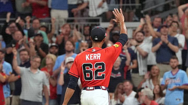 Oct 1, 2026; Cumberland, Georgia, USA; Atlanta Braves starting pitcher Ray Kerr (62) acknowledges the crowd and walks to the dugout after a pitching change against the Philadelphia Phillies during the fourth inning in game three of the Wildcard round for the 2026 MLB Playoffs at Truist Field. Mandatory Credit: Dale Zanine-Imagn Images Oct 1, 2026; Cumberland, Georgia, USA; Atlanta Braves starting pitcher Ray Kerr (62) acknowledges the crowd and walks to the dugout after a pitching change against the Philadelphia Phillies during the fourth inning in game three of the Wildcard round for the 2026 MLB Playoffs at Truist Field. Mandatory Credit: Dale Zanine-Imagn Images
