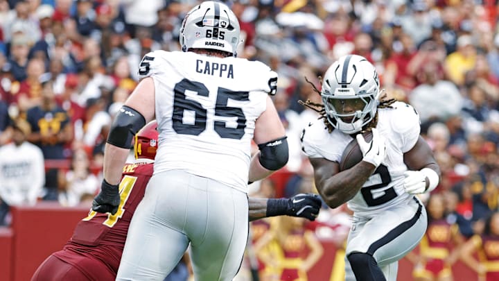 Sep 21, 2025; Landover, Maryland, USA; Las Vegas Raiders running back Ashton Jeanty (2) runs the ball during the second half against the Washington Commanders at Northwest Stadium. Mandatory Credit: Amber Searls-Imagn Images