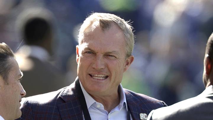 Seattle, Washington, USA;  San Francisco 49ers general manager John Lynch chats on the field before a game against the Seattle Seahawks at Lumen Field.  Mandatory Credit: Joe Nicholson-Imagn Images