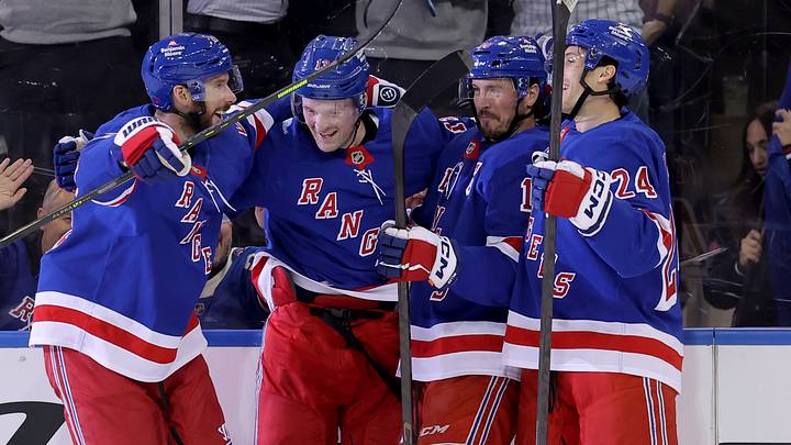 Oct 13, 2026; New York, New York, USA; New York Rangers left wing Alexis Lafreniere (13) celebrates his second goal of the period against the Tampa Bay Lightning with teammates during the first period at Madison Square Garden. Mandatory Credit: Brad Penner-Imagn Images