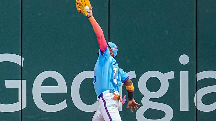 Aug 29, 2026; Cumberland, Georgia, USA; Atlanta Braves right fielder Ronald Acuna Jr. (13) catches a fly ball and runs into the outfield wall on a ball Hirt by Colorado Rockies first baseman TJ Rumfield (7) (not shown) during the eighth inning at Truist Park. Mandatory Credit: Dale Zanine-Imagn Images