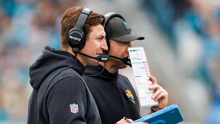 Jan 4, 2026; Jacksonville, Florida, USA; Jacksonville Jaguars offensive coordinator Grant Udinski and head coach Liam Coen during the second quarter against the Tennessee Titans at EverBank Stadium. Mandatory Credit: Morgan Tencza-Imagn Images
