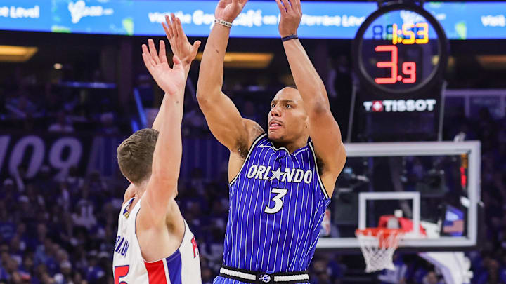 Apr 27, 2026; Orlando, Florida, USA; Orlando Magic guard Desmond Bane (3) shoots a three point basket against Detroit Pistons forward Duncan Robinson (55) during the second half during game four of the first round of the 2026 NBA Playoffs at Kia Center. Mandatory Credit: Mike Watters-Imagn Images