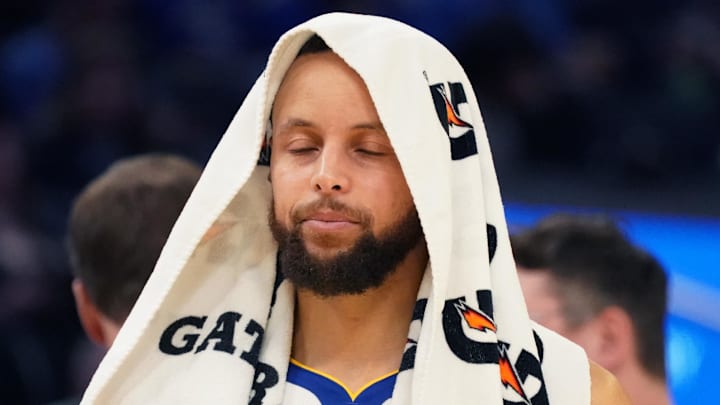 Mar 8, 2025; San Francisco, California, USA; Golden State Warriors guard Stephen Curry (30) cools off with a towel on his head during a break in the second quarter against the Detroit Pistons at Chase Center. Mandatory Credit: David Gonzales-Imagn Images
