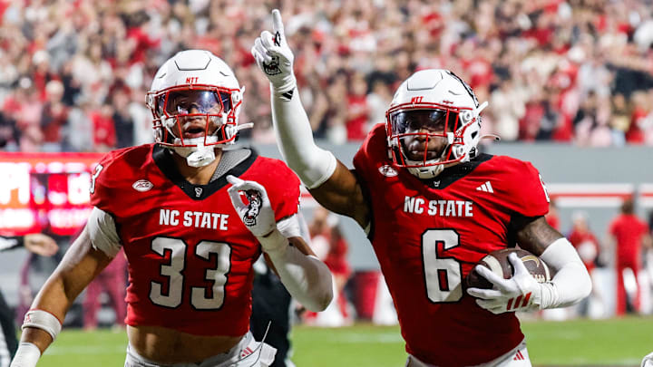 Nov 21, 2025; Raleigh, North Carolina, USA; NC State Wolfpack defensive back Devon Marshall (6) celebrates a down and runs towards the JROTC to celebrate during the first half of the game against Florida State Seminoles at Carter-Finley Stadium. Mandatory Credit: Jaylynn Nash-Imagn Images Nov 21, 2025; Raleigh, North Carolina, USA; NC State Wolfpack defensive back Devon Marshall (6) celebrates a down and runs towards the JROTC to celebrate during the first half of the game against Florida State Seminoles at Carter-Finley Stadium. Mandatory Credit: Jaylynn Nash-Imagn Images