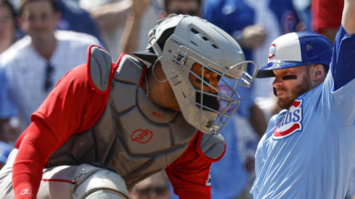 Chicago Cubs left fielder Ian Happ (8) scores against Boston Red Sox catcher Carlos Narvaez (75) during the sixth inning at Wrigley Field on July 18. 