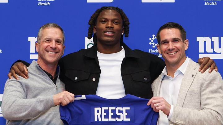 Apr 24, 2026; East Rutherford, NJ, USA; New York Giants draft pick Arvell Reese, Head Coach John Harbaugh (left) and General Manager Joe Schoen (right) pose for a photo during the introductory press conference at Quest Diagnostics Training Center. Mandatory Credit: Tom Horak-Imagn Images