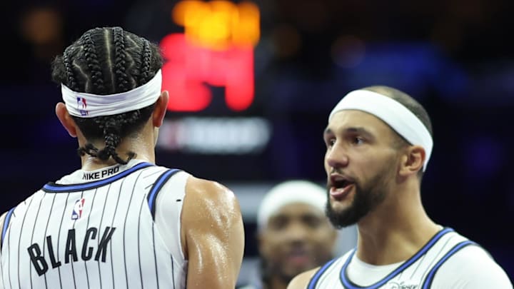Nov 25, 2025; Philadelphia, Pennsylvania, USA; Orlando Magic guard Anthony Black (0) reacts with guard Jalen Suggs (4) after scoring against the Philadelphia 76ers during the second quarter at Xfinity Mobile Arena. Mandatory Credit: Bill Streicher-Imagn Images