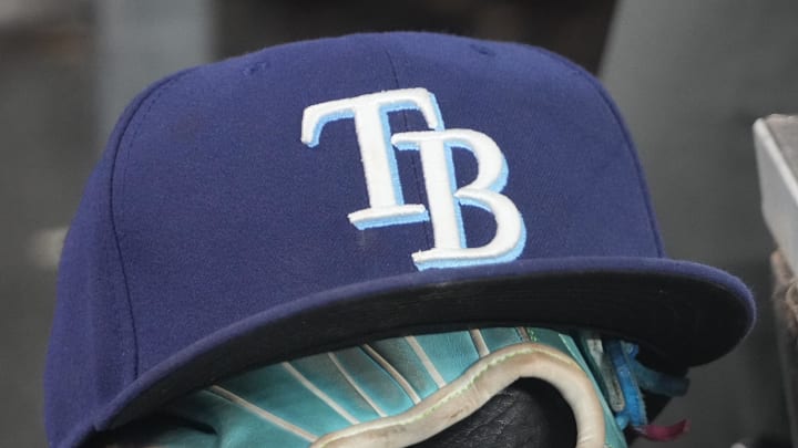 Sep 26, 2025; Toronto, Ontario, CAN; The hat and glove of Tampa Bay Rays third baseman Junior Caminero (13) in the dugout during the game against the Toronto Blue Jays at Rogers Centre. 