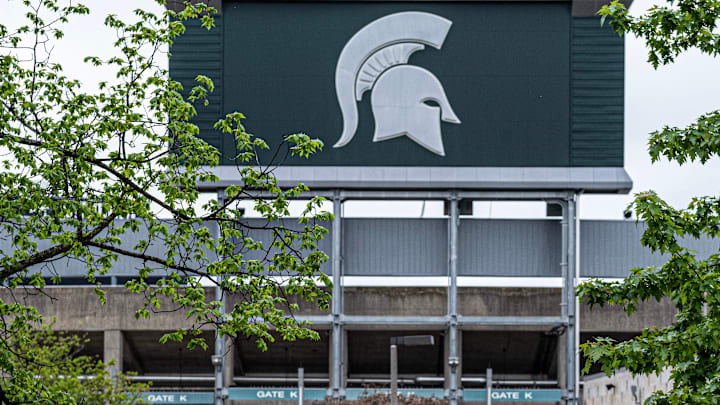 The bridge over the Red Cedar River behind Spartan Stadium provides a good backdrop for photos with the iconic Spartan logo. Photo: Sunday, May 5, 2024.