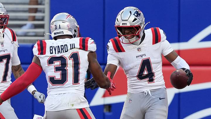 Oct 4, 2026; Orchard Park, New York, USA;  New England Patriots safety Craig Woodson (4) celebrates an interception with New England Patriots free safety Kevin Byard (31) during the fourth quarter against the Buffalo Bills at New Highmark Stadium.  Mandatory Credit: Gregory Fisher-Imagn Images
