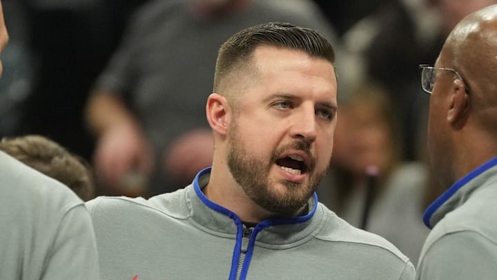 Dec 4, 2023; Sacramento, California, USA; Sacramento Kings assistant coach Luke Loucks (center) talks to head coach Mike Brown (right) during the second quarter against the New Orleans Pelicans at Golden 1 Center. Mandatory Credit: Darren Yamashita-Imagn Images