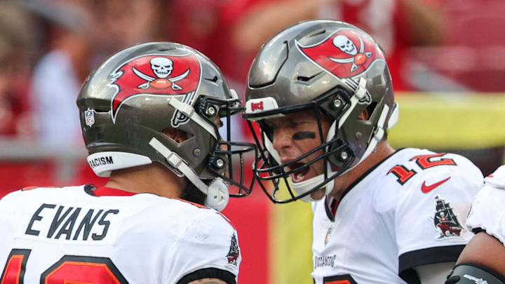Jan 1, 2023; Tampa, Florida, USA; Tampa Bay Buccaneers quarterback Tom Brady (12) congratulates wide receiver Mike Evans (13) after a touchdown against the Carolina Panthers in the second quarter at Raymond James Stadium. Mandatory Credit: Nathan Ray Seebeck-Imagn Images Jan 1, 2023; Tampa, Florida, USA; Tampa Bay Buccaneers quarterback Tom Brady (12) congratulates wide receiver Mike Evans (13) after a touchdown against the Carolina Panthers in the second quarter at Raymond James Stadium. Mandatory Credit: Nathan Ray Seebeck-Imagn Images