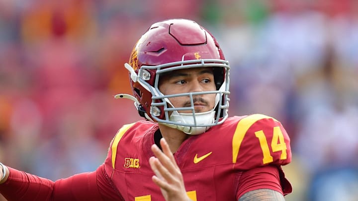 Nov 30, 2024; Los Angeles, California, USA; Southern California Trojans quarterback Jayden Maiava (14) throws against the Notre Dame Fighting Irish during the first half at the Los Angeles Memorial Coliseum. 