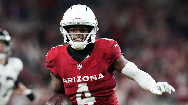 Arizona Cardinals receiver Greg Dortch (4) runs in for a touchdown after a catch against the Jacksonville Jaguars at State Farm Stadium on Nov. 23, 2025.